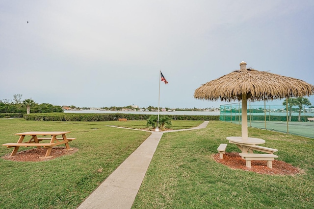 view of home's community with a yard