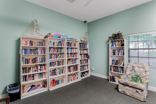 living area featuring visible vents, baseboards, and carpet