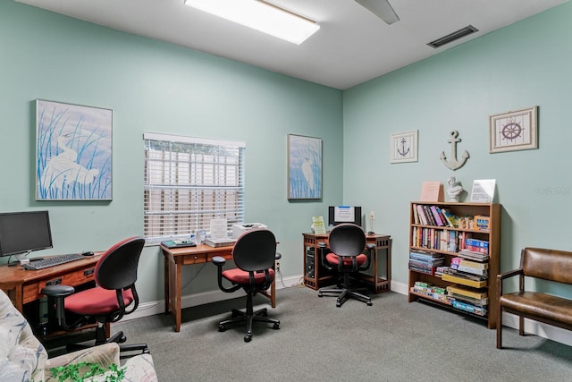 carpeted home office with baseboards and visible vents