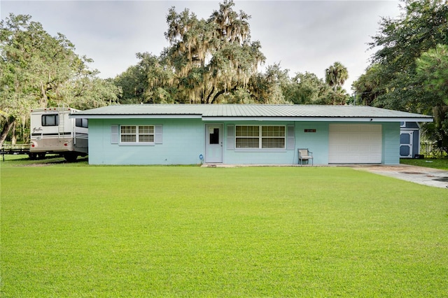 ranch-style home with a garage and a front yard