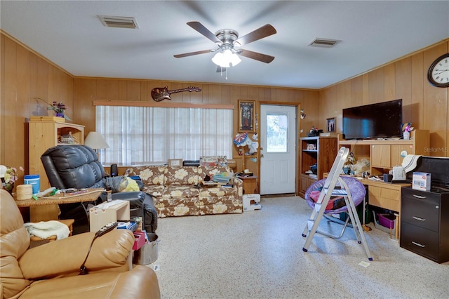 home office with wood walls and ceiling fan