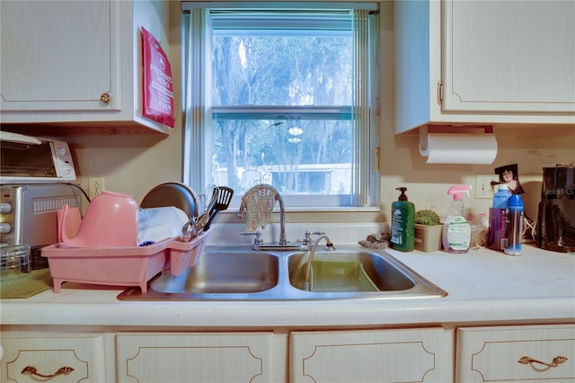 kitchen featuring plenty of natural light and sink