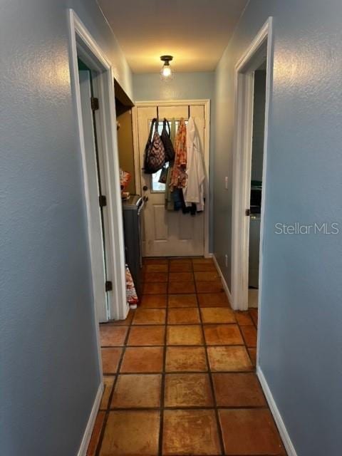 hallway with light tile patterned floors