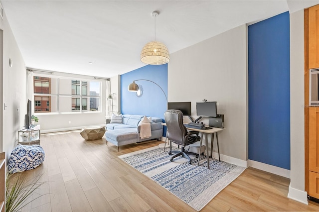 1120 E Kennedy Blvd Unit 734, Tampa, FL 33602 - home office with baseboards and wood finished floors