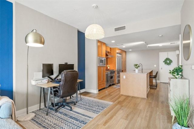 1120 E Kennedy Blvd Unit 734, Tampa, FL 33602 - office area with light wood-style flooring, visible vents, and baseboards