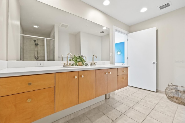 1120 E Kennedy Blvd Unit 734, Tampa, FL 33602 - bathroom with a stall shower, tile patterned flooring, visible vents, and a sink