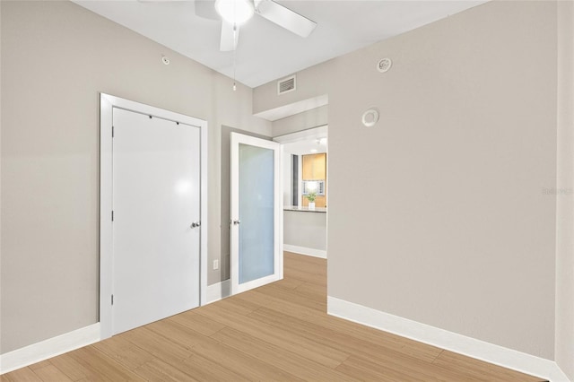 1120 E Kennedy Blvd Unit 734, Tampa, FL 33602 - spare room with visible vents, ceiling fan, light wood-style flooring, and baseboards