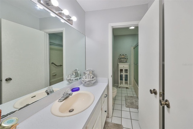 bathroom featuring tile patterned flooring, vanity, and toilet