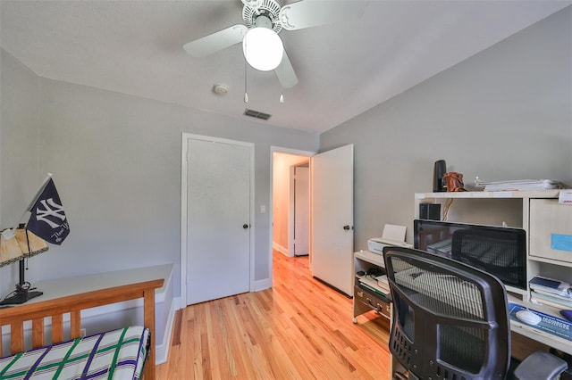 office with ceiling fan and light hardwood / wood-style floors