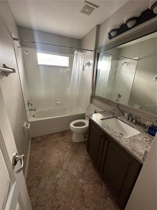 bathroom featuring a textured ceiling, toilet, vanity, visible vents, and shower / bath combination with curtain