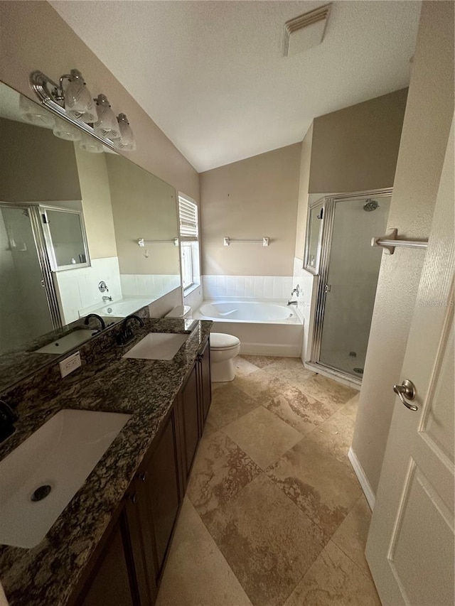 bathroom featuring a garden tub, a stall shower, a sink, and visible vents