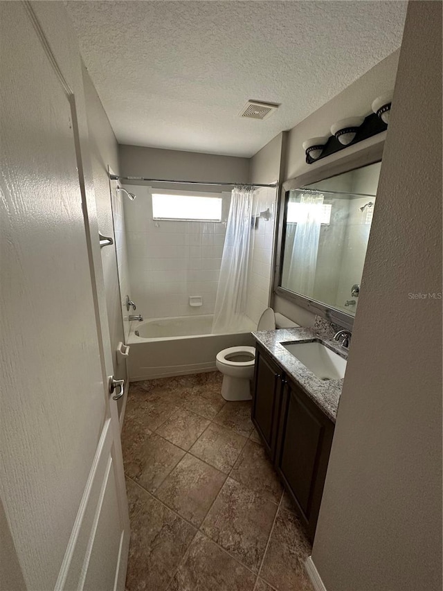 bathroom with visible vents, toilet, shower / tub combo with curtain, a textured ceiling, and vanity