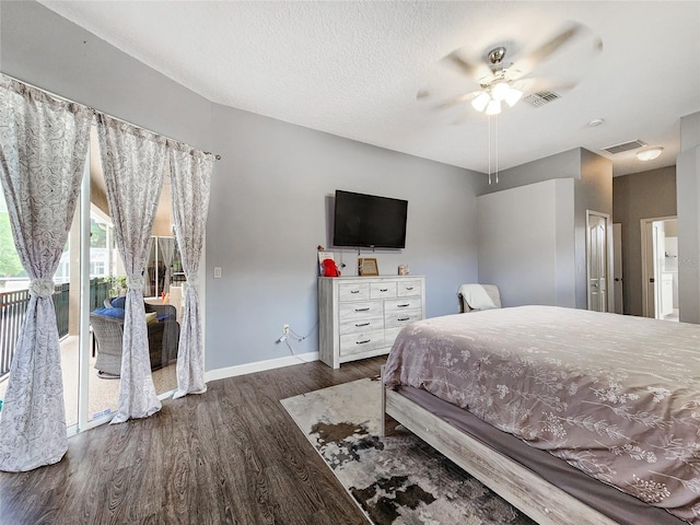 bedroom featuring a textured ceiling, ceiling fan, dark hardwood / wood-style flooring, and access to outside