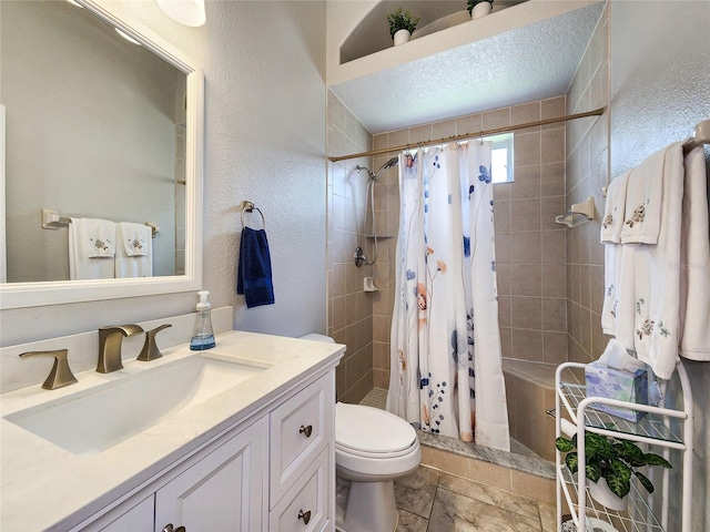 bathroom with walk in shower, toilet, a textured ceiling, and vanity