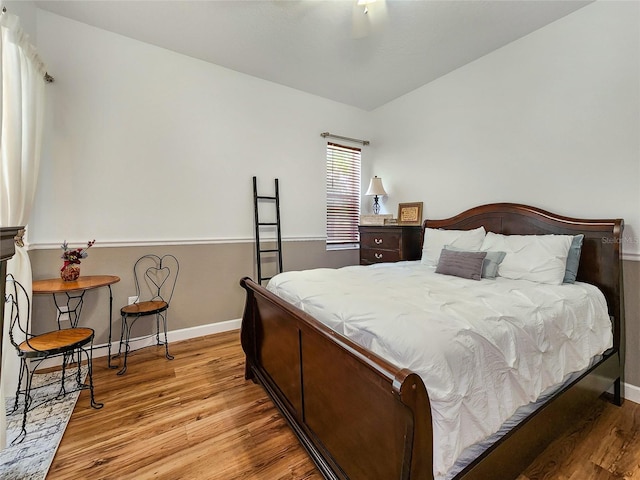 bedroom featuring light wood-type flooring and ceiling fan