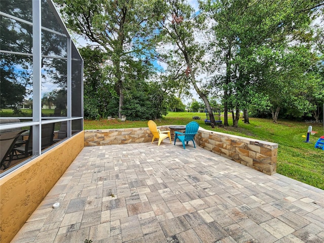 view of patio with glass enclosure