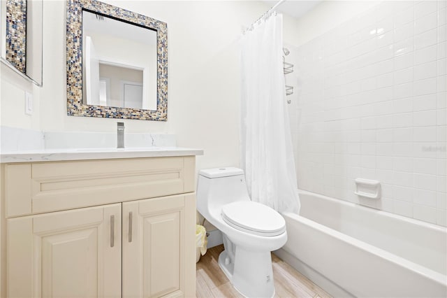 full bathroom featuring hardwood / wood-style flooring, shower / tub combo with curtain, vanity, and toilet