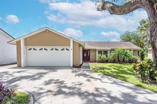 ranch-style house with a garage and a front yard