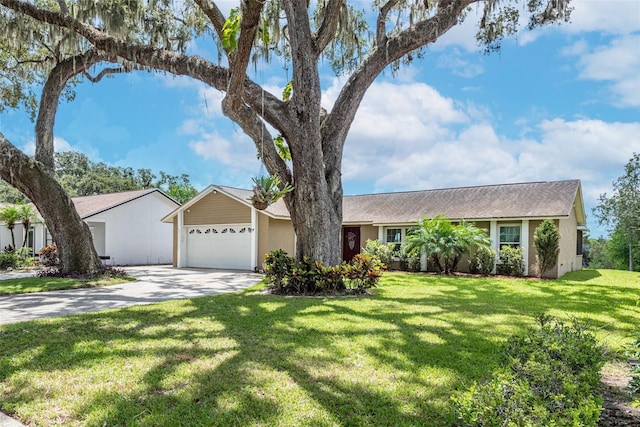 ranch-style home with a front yard and a garage