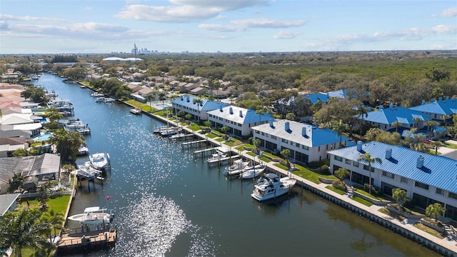 drone / aerial view featuring a residential view and a water view