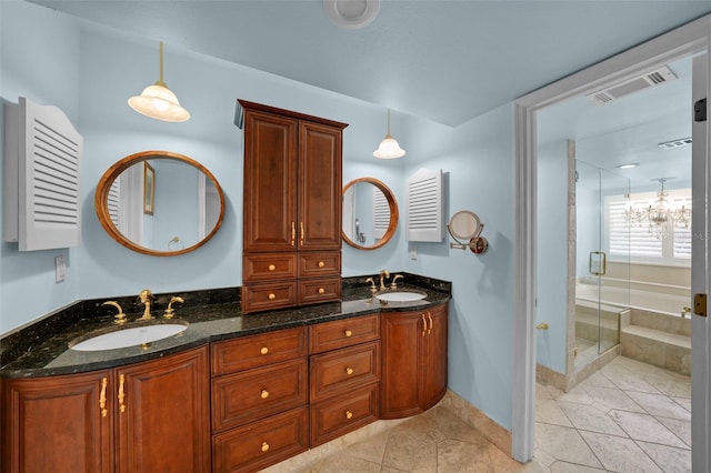 full bath with double vanity, visible vents, a sink, and a stall shower