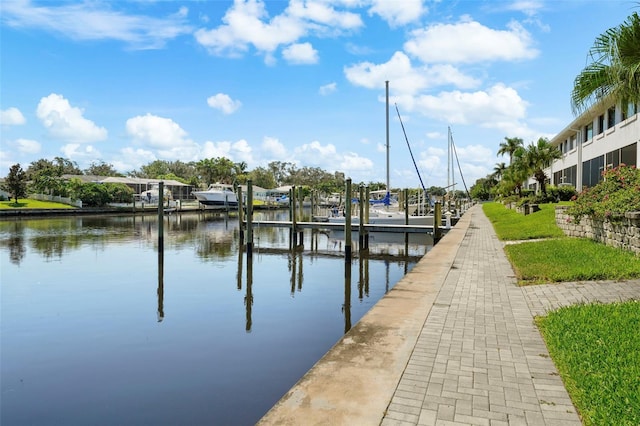 view of dock with boat lift and a water view
