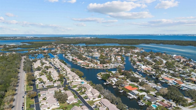 birds eye view of property with a water view and a residential view