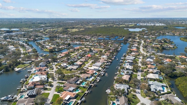 bird's eye view featuring a water view and a residential view