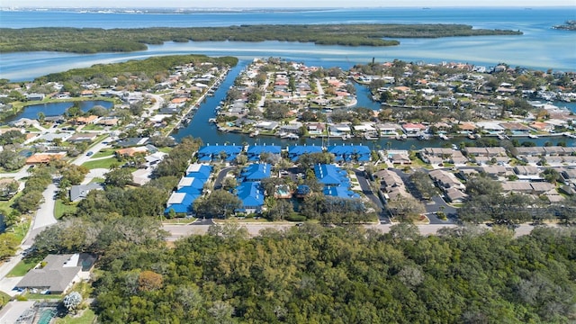 bird's eye view featuring a water view and a residential view