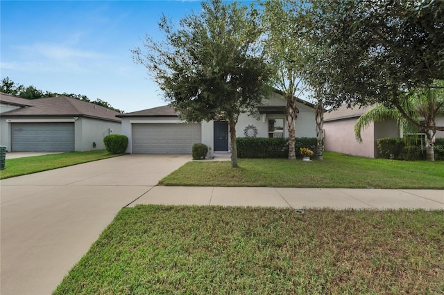 ranch-style house with a garage and a front lawn