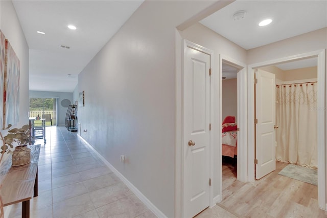 corridor featuring light hardwood / wood-style flooring