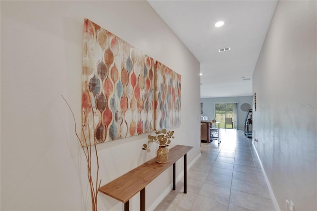 hallway with light tile patterned floors