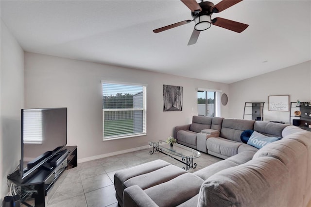 tiled living room with vaulted ceiling and ceiling fan