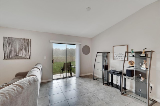 interior space featuring vaulted ceiling and light tile patterned floors