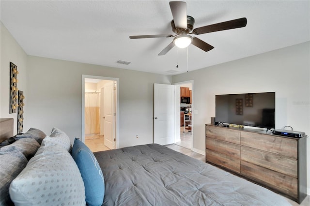 bedroom featuring connected bathroom and ceiling fan