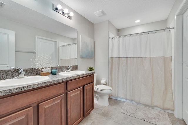 bathroom with walk in shower, vanity, toilet, and tile patterned floors