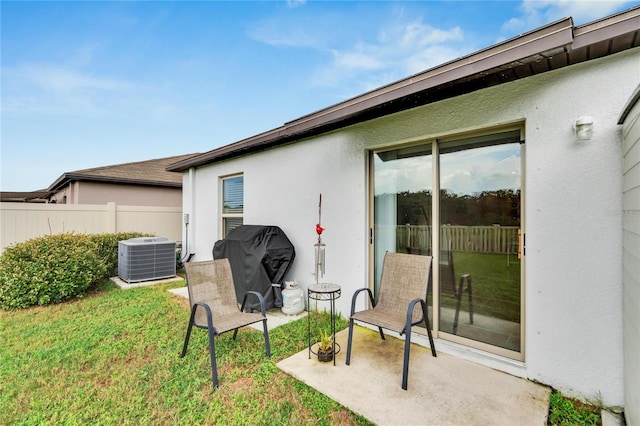 exterior space featuring a patio and cooling unit