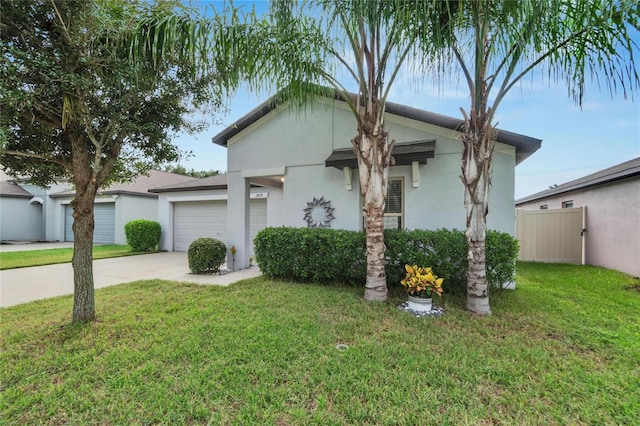 view of front of property featuring a front lawn and a garage