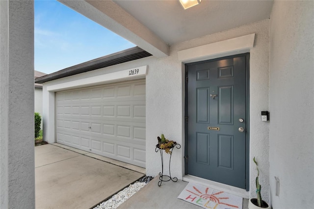 entrance to property with a garage