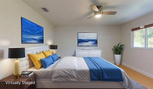 411 Harbor View Ln, Largo, FL 33770 - bedroom featuring wood finished floors, baseboards, and a ceiling fan