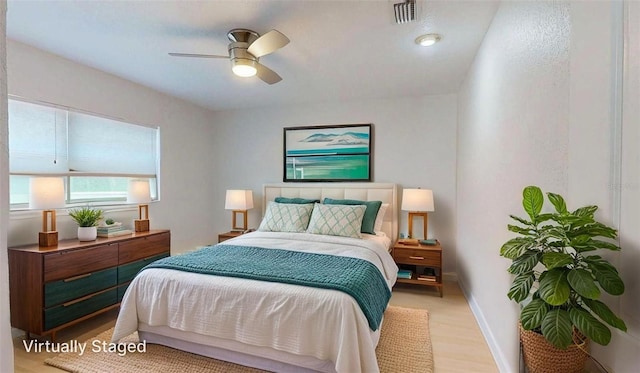 411 Harbor View Ln, Largo, FL 33770 - bedroom with light wood-type flooring, a ceiling fan, and baseboards