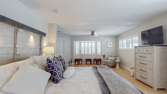 411 Harbor View Ln, Largo, FL 33770 - living room featuring ceiling fan, light wood-style floors, and baseboards