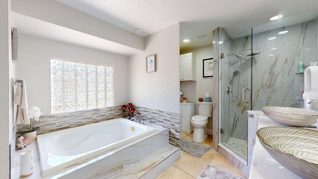 411 Harbor View Ln, Largo, FL 33770 - full bathroom featuring a garden tub, toilet, and a marble finish shower
