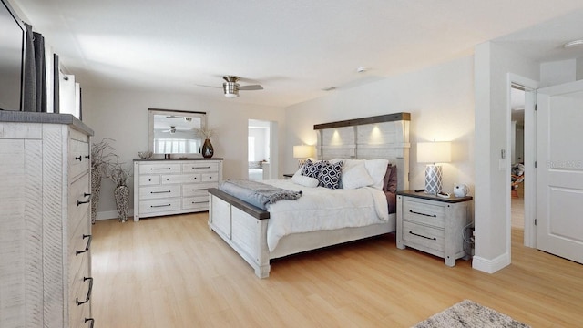411 Harbor View Ln, Largo, FL 33770 - bedroom featuring light wood-type flooring, a ceiling fan, and baseboards