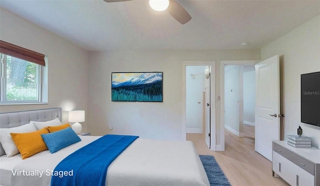 411 Harbor View Ln, Largo, FL 33770 - bedroom with light wood finished floors, ceiling fan, and baseboards