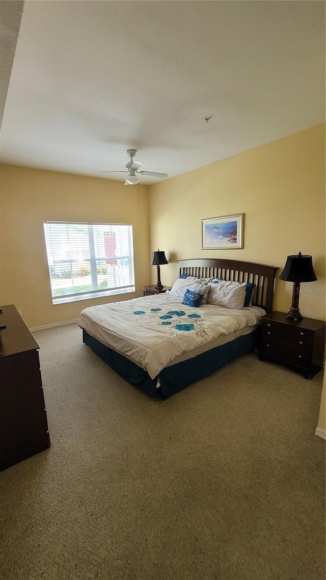 bedroom featuring ceiling fan and carpet floors