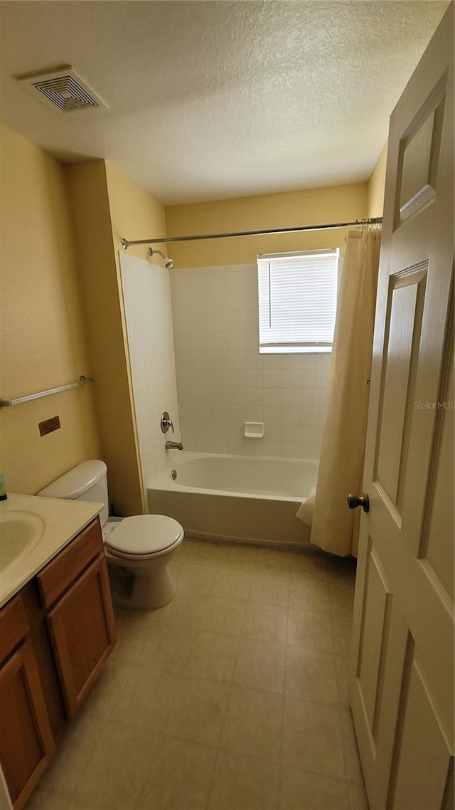 full bathroom featuring a textured ceiling, vanity, toilet, and shower / bath combination with curtain