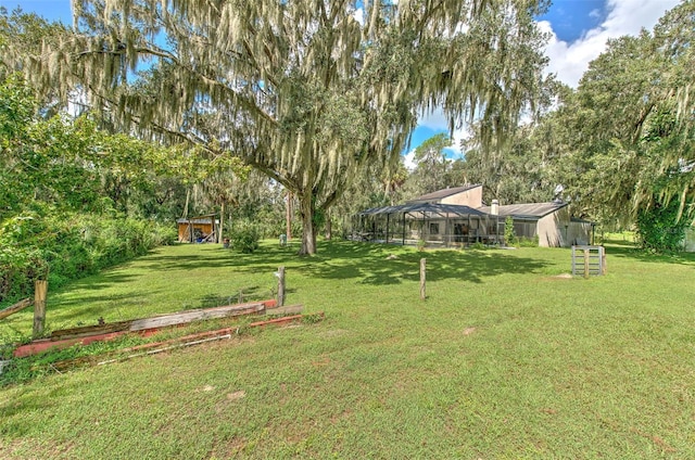 view of yard featuring a lanai