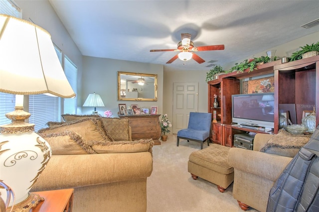 living room featuring ceiling fan and light carpet