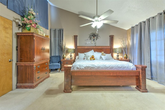 bedroom with ceiling fan, light colored carpet, and lofted ceiling